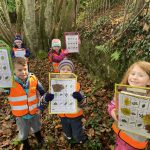 Children showing their tree identification tables