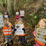 Children showing their tree identification tables