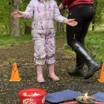 Girl successfully makes a flint fire