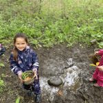 Delight in making a mud pie