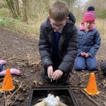 Boy starting a fire