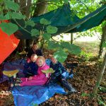 A group under cover of our den