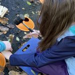 splitting wood with a hammer